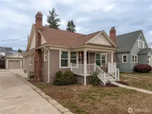 Front exterior of 1928 Craftsman bungalow at 212 N Emerson Ave Wenatchee with covered porch and detached garage