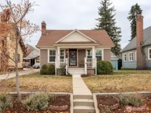Front exterior of charming 1928 Craftsman bungalow with classic covered porch