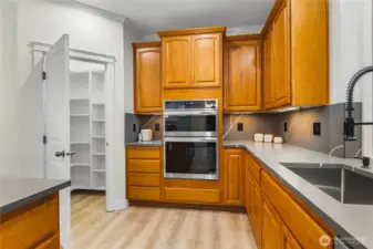 Spacious kitchen complemented by a generous walk-in pantry