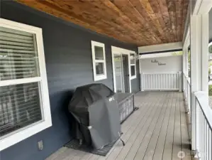 Large covered back deck overlooking the lake