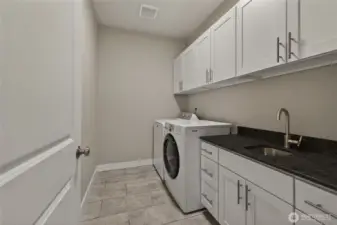 Laundry room with utility sink and great storage