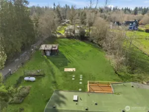 View just off the roof at the back yard. Ample room for gardens or a small animal farm~