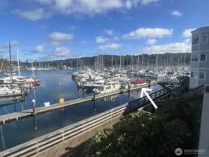 Murphy’s Landing boardwalk — stroll from your slip to downtown Gig Harbor’s shops, dining, and waterfront views.