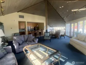 Upstairs clubhouse living space with kitchen at Murphy’s Landing Marina in downtown Gig Harbor — shared lounge and marina-view deck access.
