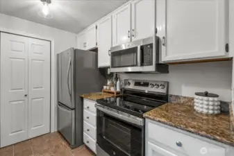 The kitchen has brand new stainless steel appliances, a great pantry, and new modern lighting.