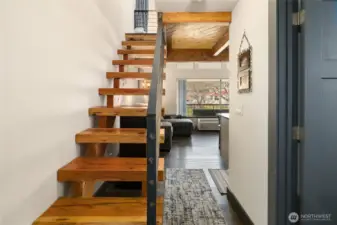 Hardwood stairs and modern metal railing--nice touch!