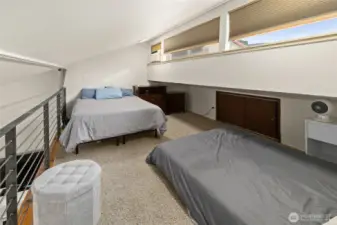 Upper loft area-light filled with two double beds!