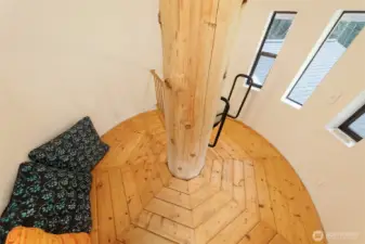 This is in the tower! A couple of adults can stand up here, or kids love to curl up on the pillows and read.