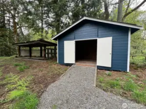 Nice newer 16 x 18 shop and wood shed.