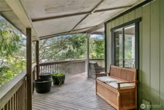 Enjoy the outdoors in any weather on the covered wraparound deck.