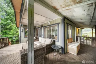 Full view of the expansive covered deck, an ideal bonus space for gatherings or peaceful mornings.