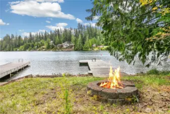 A close-up of the dock and firepit area, perfect for gathering with guests and roasting marshmallows under the stars.
