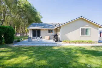 Back of home with patio for BBQ or relazing