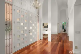 25 foot ceilings await you at this grand entrance to living space with new custom front door.