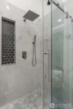 New shower with ceramic tile and custom floating glass door.