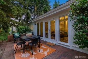 Back patio surrounded by terrestrial garden.