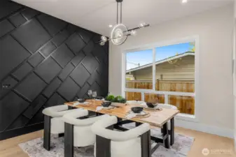 Large dining room with accent wall