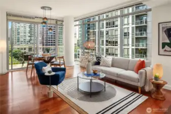 Enjoy an expansive living and dining room with hardwood floors and fresh paint.