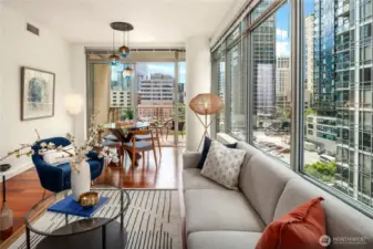 The livinOne of the many benefits of concrete and steel buildings is the floor to ceiling windows with wonderful natural light.g room let