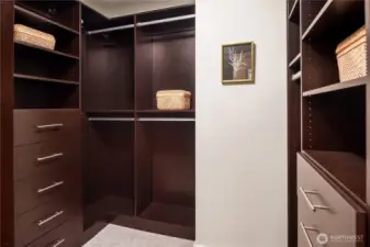 Enjoy custom California Closets in your primary bedroom closet.