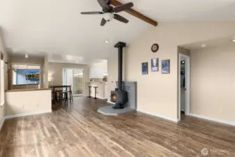 Open to eating area and kitchen and then into hall w/ bathroom.