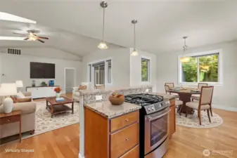 Virtually staged view looking toward the living room and primary bedroom