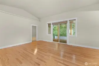 Primary bedroom and sliding door to the covered deck