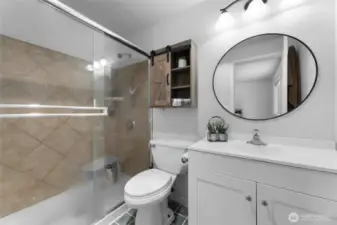 Primary bathroom with large shower, sink and toilet