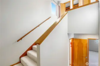 Easy-to-navigate steps connect main living areas to upstairs bedroom