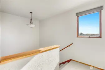 Open railing design keeps the space bright and connected
