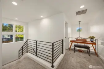 Lots of light from big windows. Lovely landing for desk or music area.