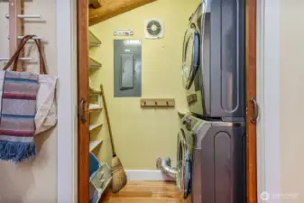 Laundry room with storage located off of entry way.