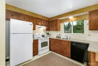 granite counters & tile back splash-view to back yard is territorial