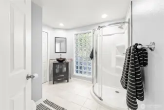 Main floor 3/4 bathroom with beautiful natural light.