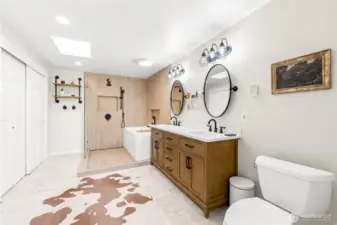 Primary en suite bathroom with imported spanish porcelain tile and heated tile floors. Large close. Dual vanity. XL soaking tub