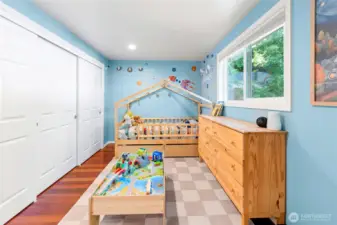 3rd bedroom with large california closet and views of the courtyard