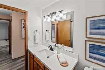 Main bath off hallway to the left of entry