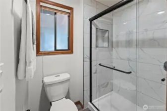 Brand new shower, fixture and flooring in primary bath