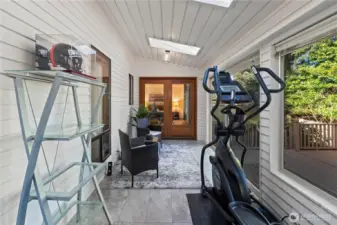 Sunroom with french doors to primary bedroom, view from eat in kitchen