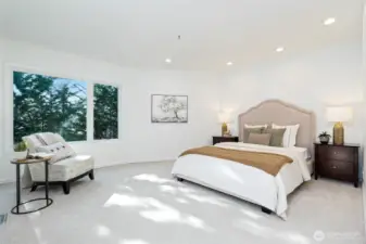 Oversized primary bedroom with walk in closet and bath.