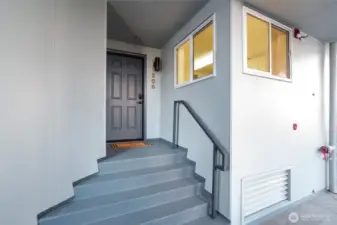 Newly painted exterior steps up to the front door