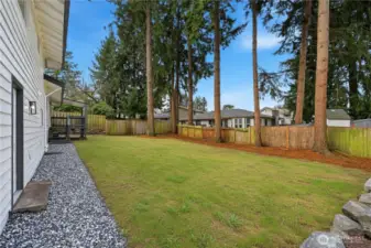 Large fenced backyard. Virtually enhanced grass.