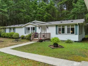 A welcoming garden greets you at the entrance, setting the tone with colorful plantings and a peaceful, inviting feel as you arrive home.