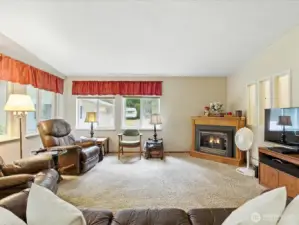 This photo offers a perspective of the family room as seen from the kitchen, highlighting the open layout and natural flow between the two spaces.