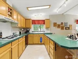 The kitchen offers excellent storage with ample cabinetry and thoughtfully designed space to keep everything organized and within easy reach.