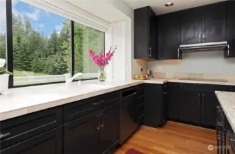 This oversized kitchen with its abundance of cabinetry makes the most of storage space.