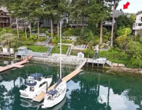 Shared deep water dock sits on the north property line and is shared with the   neighbor. An oversized deck at the waters edge. Lots of fun to be had in the sunshine. Launch your kayaks or take a dip in the water!