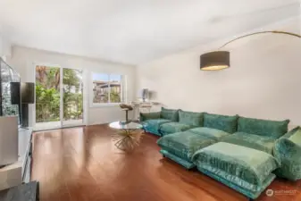 Spacious living room with sliding doors to balcony