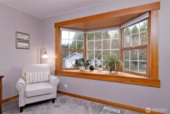 Primary bedroom with a cool bay window.