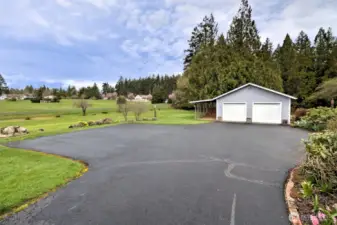Nice paved driveway leading to the 2-car garage.
